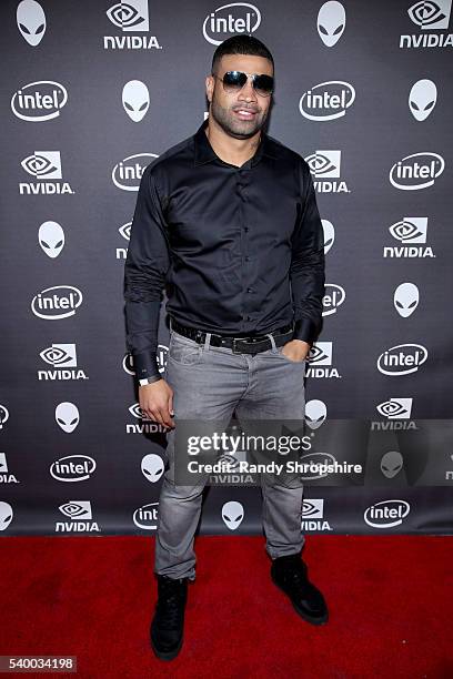 Player Shawne Merriman checks out the latest virtual reality and gaming technology at a VIP Alienware Party during E3, in partnership with NVIDIA and...