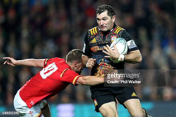 Stephen Donald of the Chiefs is tackled by Rhys Priestland of Wales during the International Test match between the Chiefs and Wales at Waikato...