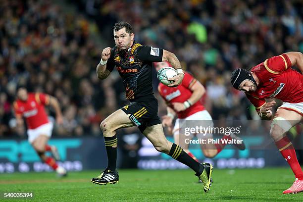 Stephen Donald of the Chiefs makes a break during the International Test match between the Chiefs and Wales at Waikato Stadium on June 14, 2016 in...