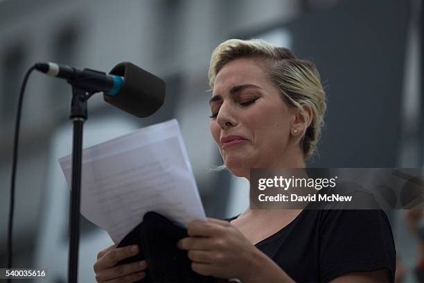 Singer Lady Gaga tries not to cry while reading some of the names of the dead at a vigil for the worst mass shooing in United States history on June...