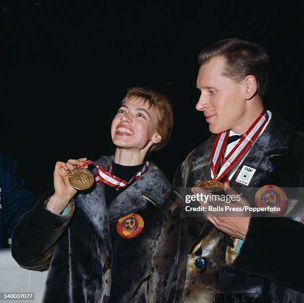 Russian figure skaters, Ludmila Belousova and Oleg Protopopov pictured together with their Olympic gold medals for pair skating awarded at the 1964...