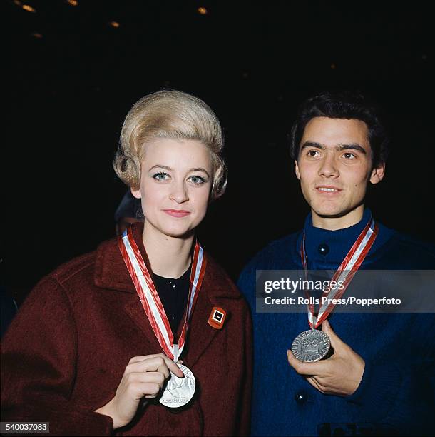 German figure skaters, Marika Kilius and Hans-Jurgen Baumler pictured together with their Olympic silver medals for pair skating awarded at the 1964...