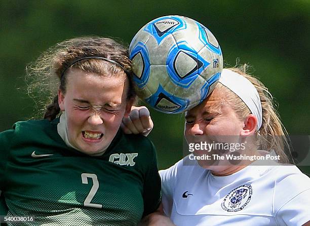 Cox forward Kayla Hamric and Battlefield mid Mia Traiano head the ball during the Virginia 6A girls' soccer championship on June 11, 2016 in Fairfax,...
