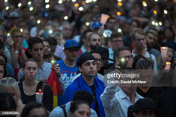 People mourn at a vigil for the worst mass shooing in United States history on June 13, 2016 in Los Angeles, United States. A gunman killed 49 people...