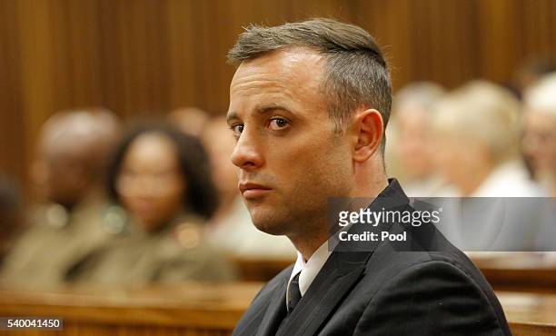 Oscar Pistorius is seen inside the dock at the high court in Pretoria for his sentencing hearing at the high court in Pretoria on June 14, 2016 in...