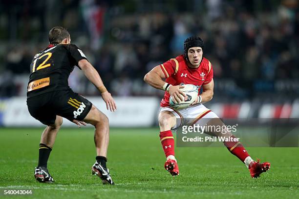 Matthew Morgan of Wales looks for a way around Andrew Horrell of the Chiefs during the International Test match between the Chiefs and Wales at...