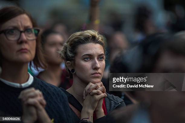 People mourn at a vigil for the worst mass shooing in United States history on June 13, 2016 in Los Angeles, United States. A gunman killed 49 people...