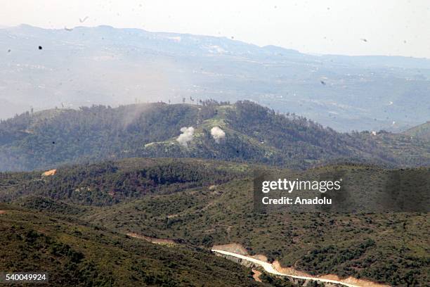 Photo taken from Yayladagi district of Turkey's Hatay province shows rising smoke as the Assad forces hit the Turkmen Mountain, in Latakia, Syria on...