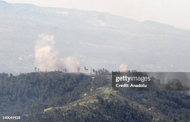 Photo taken from Yayladagi district of Turkey's Hatay province shows rising smoke as the Assad forces hit the Turkmen Mountain, in Latakia, Syria on...