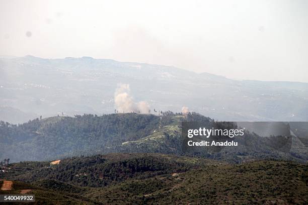 Photo taken from Yayladagi district of Turkey's Hatay province shows rising smoke as the Assad forces hit the Turkmen Mountain, in Latakia, Syria on...