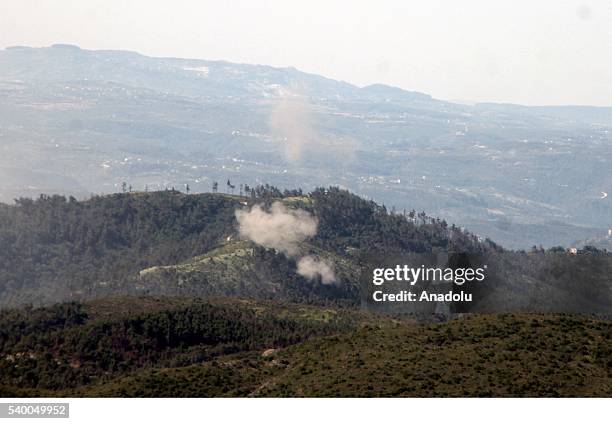 Photo taken from Yayladagi district of Turkey's Hatay province shows rising smoke as the Assad forces hit the Turkmen Mountain, in Latakia, Syria on...