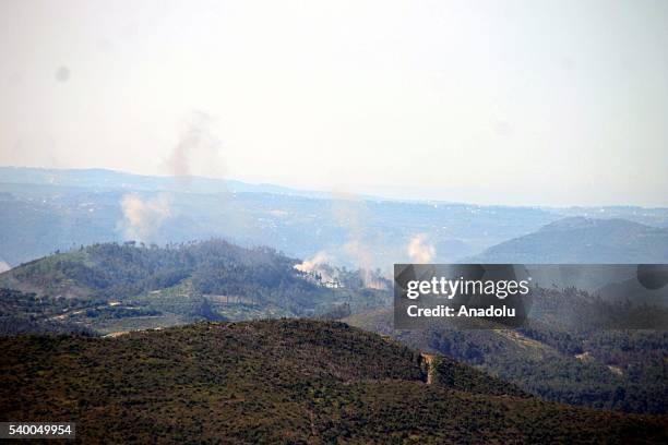 Photo taken from Yayladagi district of Turkey's Hatay province shows rising smoke as the Assad forces hit the Turkmen Mountain, in Latakia, Syria on...