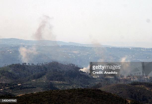 Photo taken from Yayladagi district of Turkey's Hatay province shows rising smoke as the Assad forces hit the Turkmen Mountain, in Latakia, Syria on...