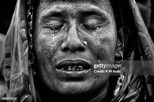 Relatives of victims take part in a special prayer near the damaged site after the end of the rescue work after 20 days following the Rana Plaza...