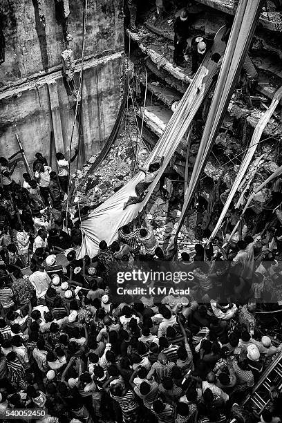 Rescue workers take part in the rescue of the eight-storey building Rana Plaza which collapsed at Savar, Dhaka Bangladesh, 25 April 2013. Reports...