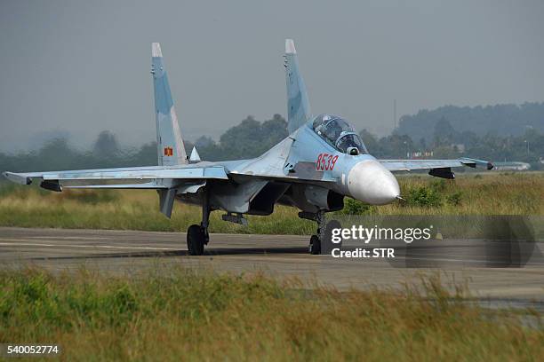 This photograph taken on October 21, 2015 shows a Vietnam Air Force Sukhoi Su-30MK2 multirole fighter aircraft, similar to the jet fighter that...