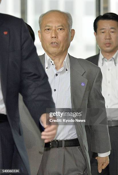 Tokyo Gov. Yoichi Masuzoe arrives at the metropolitan government offices on June 13 ahead of a meeting of the Tokyo assembly's General Affairs...