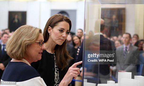 Catherine, The Duchess of Cambridge chats with Elizabeth Dibble, deputy chief of mission, as they look at a model of the new US Embassy which will be...
