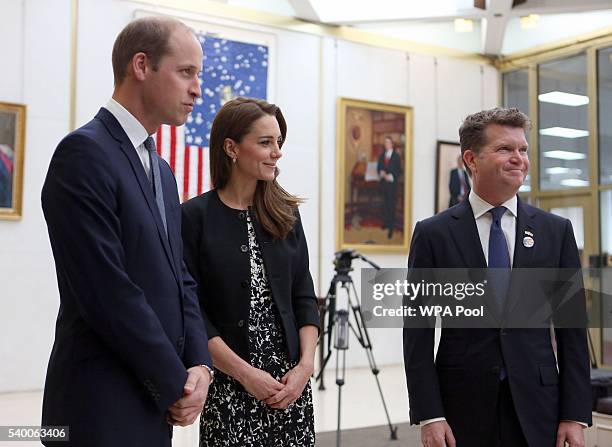 Prince WIlliam, The Duke of Cambridge and Catherine, Duchess of Cambridge talk with Matthew Barzun , US Ambassador to London after signing a book of...