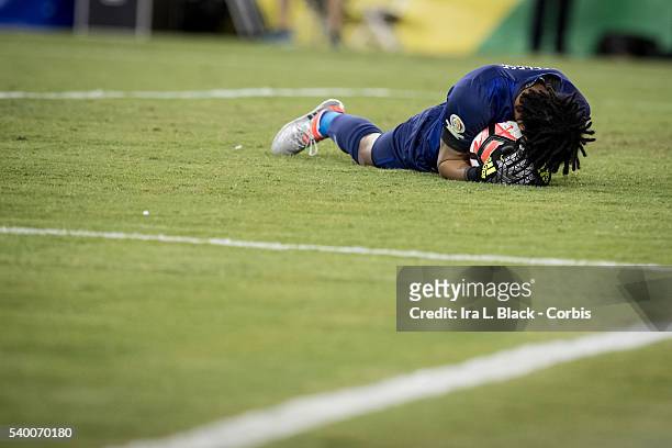Peru national team goalkeeper Pedro Gallese holds the ball tightly after stopping another advance by Brazil during the Soccer, 2016 Copa America...