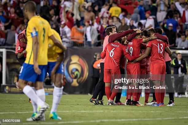 Peru national team player Miguel Trauco Victor Yotun Renato Tapia and others celebrate their win to advance to the quarterfinals with Brazil captain...