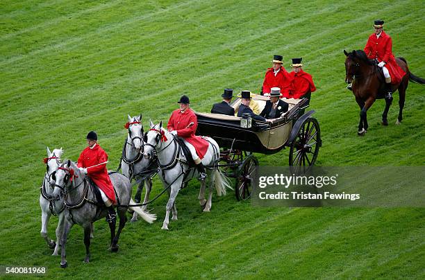 Queen Elizabeth II, Prince Philip, Duke of Edinburgh, Prince Harry and Prince Andrew, Duke of York arrive by carriage as seen from the Royal...