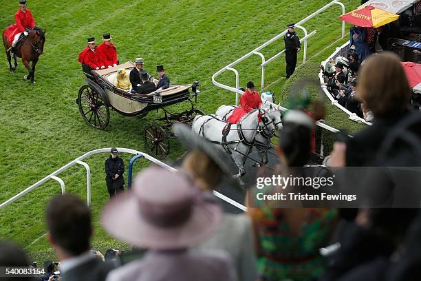 Queen Elizabeth II, Prince Philip, Duke of Edinburgh, Prince Harry and Prince Andrew, Duke of York arrive by carriage as seen from the Royal...