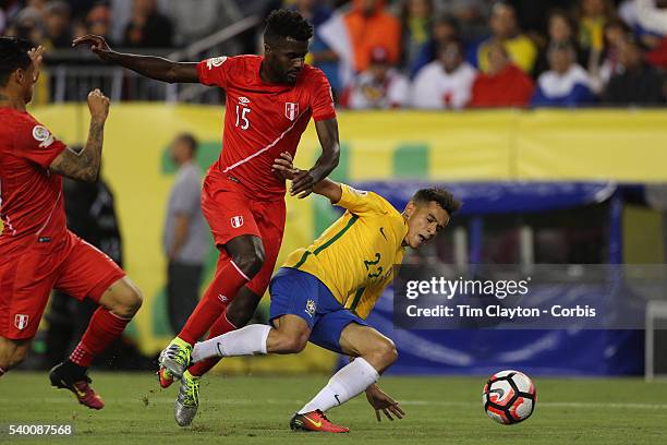 Philippe Coutinho of Brazil is knocked off the ball by Christian Ramos of Peru during the Brazil Vs Peru Group B match of the Copa America Centenario...