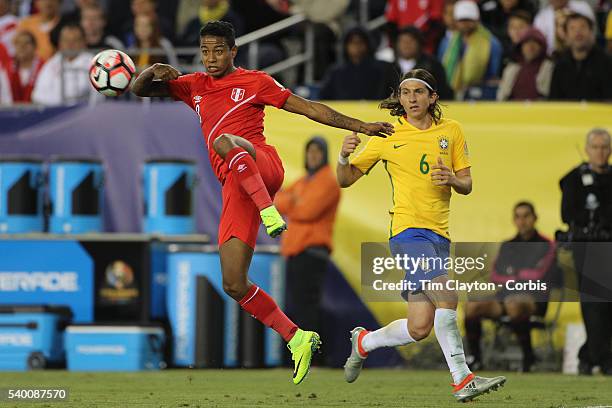 Andy Polo of Peru clears the ball as Filipe Luis of Brazil looks on during the Brazil Vs Peru Group B match of the Copa America Centenario USA 2016...