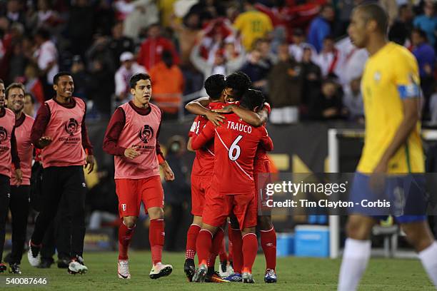Peru celebrate their 1-0 win as Miranda of Brazil looks on during the Brazil Vs Peru Group B match of the Copa America Centenario USA 2016 Tournament...