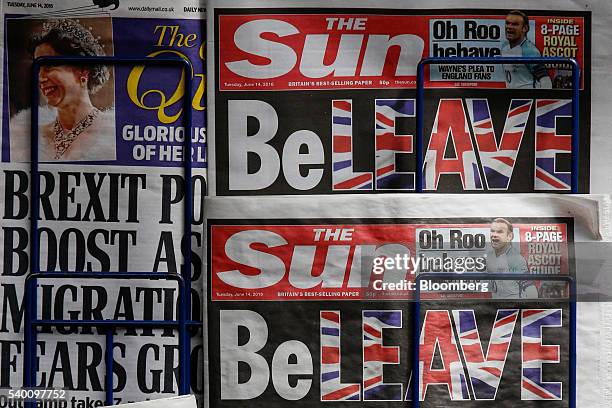 Copies of "The Sun" newspaper sit on a news stand in this arranged photograph in London, U.K., on Tuesday, June 14, 2016. The tabloid paper,...