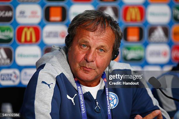 In this handout image provided by UEFA, Head Coach Jan Kozak of Slovakia talks to the media during the Slovakia Press Conference at the Stade Pierre...