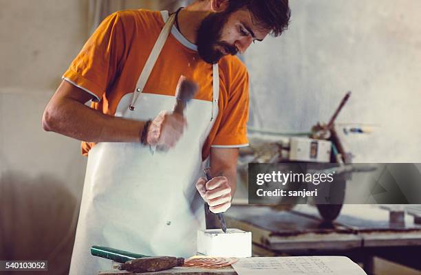 stonecutter portrait at work - sculptor stock pictures, royalty-free photos & images