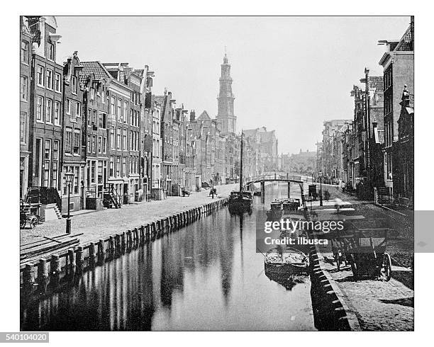 antique photograph of a canal in amsterdam (netherlands)-19th century - facade stock illustrations