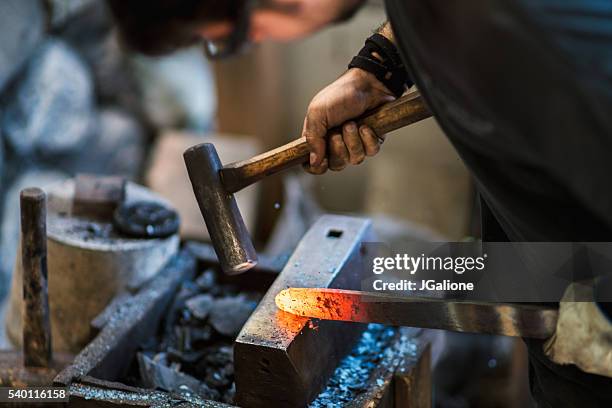 blacksmith shaping a traditional japanese cooking knife - blacksmith shop stock pictures, royalty-free photos & images