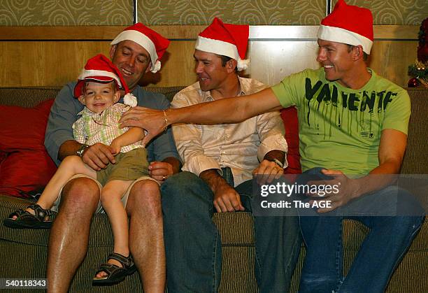 Australian cricketer Darren Lehmann, with son Ethan gets some attention from captain Ricky Ponting and Brett Lee, before Christmas lunch at Crown...