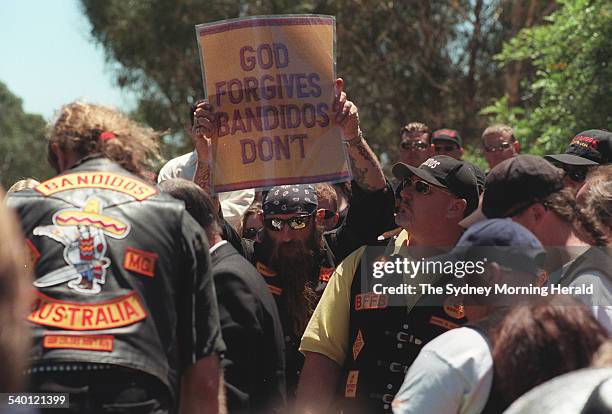 Members of the Bandido motorbike gang attend the funeral of their Mulgoa to bury their national president, Michael Kulakowski, in Mulgoa, one holding...