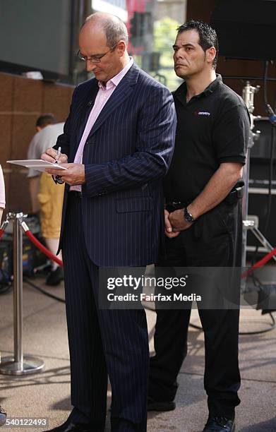 Sunrise host David Koch, with security, outside the Channel Seven studios in Martin Place, Sydney, 12 October 2006. SHD Picture by GRANT TURNER