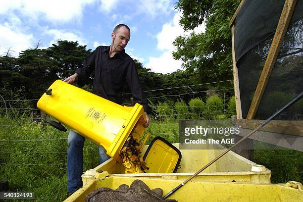 Stuart Lucca-Pope of Bebida Cafe in Smith Street, Fitzroy empties his organic waste at the Collingwood Childrens' Farm, 29 October 2004. The AGE...