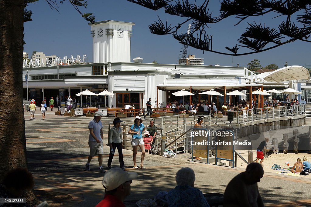 People enjoy the seaside atmosphere at the Bavarian Bier Cafe at Manly wharf, 20