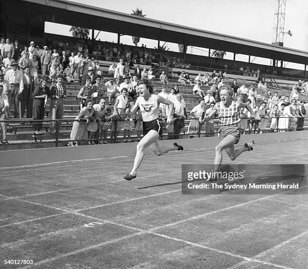 Betty Cuthbert, right, and Marlene Matthews race to the finish line during the Women's Athletics State Championship and R.H. North Cup at the...