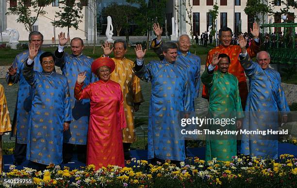 Leaders of the APEC countries pose for a photograph wearing traditional Vietnamese silk gowns, including Australian Prime Minister John Howard, at...