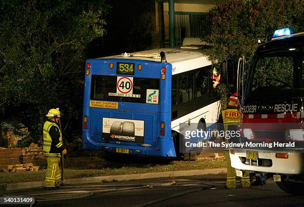Emergency workers attend the scene of an accident where a bus crashed into a block of units on the Pacific Highway at Chatswood, 1 November 2006. SMH...