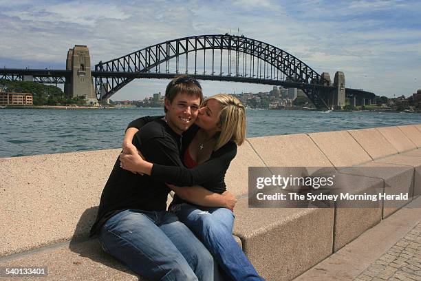 Australian golfer Aaron Baddeley and his wife Richelle pose in front of the Sydney Harbour Bridge, 12 November 2006. SMH Picture by TIM CLAYTON