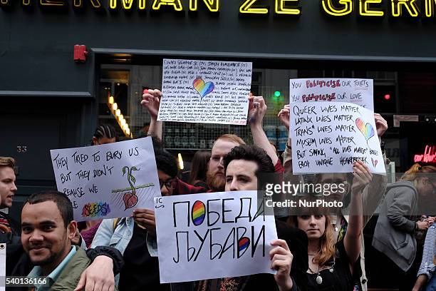People gather in Old Compton Street in the Soho district of London for a vigil in commemoration and solidarity with the victims of the Orlando...