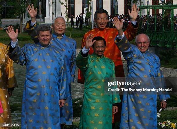 Leaders of the APEC countries pose for a photograph wearing traditional Vietnamese silk gowns, including Australian Prime Minister John Howard, at...