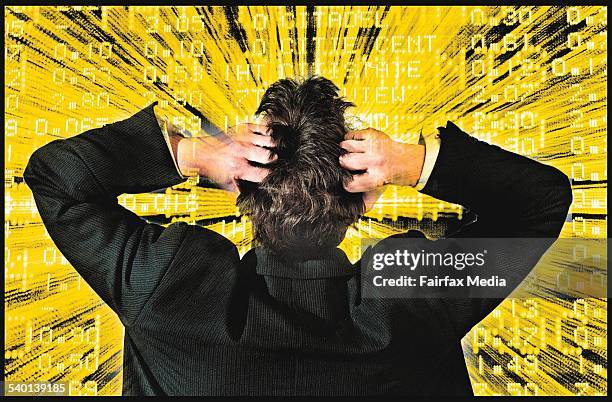 Businessman holds his head as looks at the stock market, 15 September 2001. AFR Photo-Illustration by JIM RICE Note: This image has been digitally...