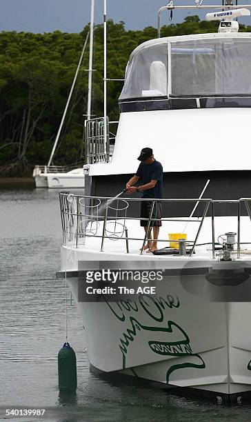 Deck hand cleans down Croc One, the boat Steve Irwin was diving from when he was killed by a Sting Ray near Batt Reef off the coast of Port Douglas...