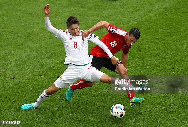 Adam Nagy of Hungary controls the ball under pressure of Zlatko Junuzovic of Austria during the UEFA EURO 2016 Group F match between Austria and...