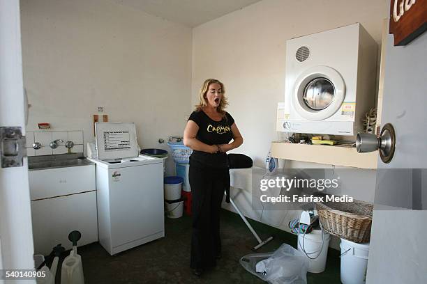 Opera in the Bush. Opera Australia's OzOpera singer Sharon Prero warms up in the laundry of the cast's motel in Narrandera. The singers travelled to...